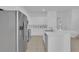 Kitchen featuring stainless steel appliances, an island with a sink, and ample white cabinets at 3929 Corrine Dr, Orlando, FL 32814