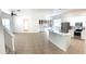 Modern kitchen with white cabinets, island, and stainless steel appliances at 3929 Corrine Dr, Orlando, FL 32814