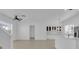 Open-concept living area with modern lighting, tile floors, and stainless steel appliances at 3929 Corrine Dr, Orlando, FL 32814