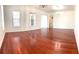 Large living room with hardwood floors and a chandelier at 3929 Corrine Dr, Orlando, FL 32814