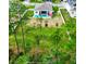 Aerial view of a home with a pool, nestled in a spacious, fenced backyard with mature trees at 4223 Sunset Preserve Blvd, Orlando, FL 32820