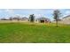 Expansive backyard features lush lawn and a covered patio, great for outdoor activities at 4223 Sunset Preserve Blvd, Orlando, FL 32820