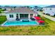 Inviting backyard featuring a sparkling pool, spa, lounge chairs, and ample space for outdoor entertainment and relaxation at 4223 Sunset Preserve Blvd, Orlando, FL 32820