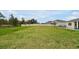 Spacious backyard with lush green grass, offering plenty of space for outdoor activities at 4223 Sunset Preserve Blvd, Orlando, FL 32820