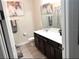 Stylish bathroom featuring a modern vanity, decorative accents, and ample counter space for a functional and appealing design at 4223 Sunset Preserve Blvd, Orlando, FL 32820