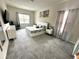 Spacious bedroom with neutral tones, featuring a large bed, ample natural light, and modern decor at 4223 Sunset Preserve Blvd, Orlando, FL 32820