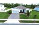 Beautiful one-story home with a well-maintained lawn, brick driveway, and two-car garage at 4223 Sunset Preserve Blvd, Orlando, FL 32820