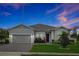 Charming single-story home with a well-manicured lawn, mature trees, and a two-car garage at 4223 Sunset Preserve Blvd, Orlando, FL 32820