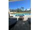 Inviting backyard featuring a pool, integrated spa, fire pit, and comfortable patio furniture on a paved deck at 4223 Sunset Preserve Blvd, Orlando, FL 32820