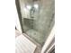 The bathroom boasts a glass-enclosed shower with gray tiling and modern fixtures at 4223 Sunset Preserve Blvd, Orlando, FL 32820