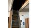 Convenient attic access via a pull-down ladder, blending function with modern living at 5138 Andrea Blvd, Orlando, FL 32807
