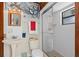 Nautical themed bathroom with a pedestal sink, walk-in shower, and charming decor at 5138 Andrea Blvd, Orlando, FL 32807