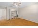 Bedroom featuring neutral walls, carpet flooring, a ceiling fan, and closet with built-in shelving and seating at 5138 Andrea Blvd, Orlando, FL 32807