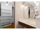 Bedroom featuring built-in vanity area, closet, and neutral paint at 5138 Andrea Blvd, Orlando, FL 32807
