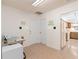 Bright entryway with tile flooring and access to the garage, primary bedroom, and kitchen at 5138 Andrea Blvd, Orlando, FL 32807