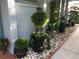 Exterior close-up featuring potted plants and landscaping details along the side of the house at 5138 Andrea Blvd, Orlando, FL 32807