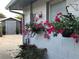 Charming exterior with vibrant flower boxes and view of the shed in the background at 5138 Andrea Blvd, Orlando, FL 32807