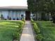Charming home featuring a landscaped front yard with neatly trimmed bushes at 5138 Andrea Blvd, Orlando, FL 32807