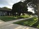 Well-manicured front yard with a sidewalk leading to the house at 5138 Andrea Blvd, Orlando, FL 32807