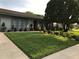 Landscaped front yard with mature trees and shrubs enhancing the curb appeal of this lovely home at 5138 Andrea Blvd, Orlando, FL 32807