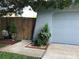 Well maintained garage with tidy landscaping, mature trees, and a clean driveway at 5138 Andrea Blvd, Orlando, FL 32807