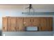 Garage features wooden cabinets with detailed trim offering ample storage space at 5138 Andrea Blvd, Orlando, FL 32807