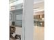 Office featuring built-in shelving, desk, and view to kitchen at 5138 Andrea Blvd, Orlando, FL 32807