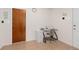 A functional office area features natural light, file cabinet, and a glass desk at 5138 Andrea Blvd, Orlando, FL 32807