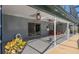 Covered patio area for outdoor dining and lounging, complemented by lush foliage at 5138 Andrea Blvd, Orlando, FL 32807