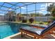 Relaxing lounge chairs by the sparkling pool, ideal for sunny days and outdoor living at 5138 Andrea Blvd, Orlando, FL 32807