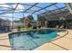 Outdoor pool area featuring seating, tropical greenery, and pool equipment room with white privacy fencing at 5138 Andrea Blvd, Orlando, FL 32807