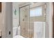 Shower featuring tile and a glass door at 5138 Andrea Blvd, Orlando, FL 32807