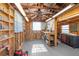 A well organized work shop with shelves, tool storage and ceiling fan at 5138 Andrea Blvd, Orlando, FL 32807