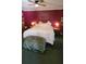 Large main bedroom with a king-size bed, plush bedding, and a ceiling fan at 9130 Dollanger Ct, Orlando, FL 32819
