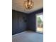 Bedroom with dark-painted walls, carpeting, and access to a deck at 9130 Dollanger Ct, Orlando, FL 32819