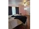 Bedroom with pink walls, wood flooring, and ample natural light at 9130 Dollanger Ct, Orlando, FL 32819