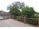 Spacious deck with wood railings, overlooking lush trees at 9130 Dollanger Ct, Orlando, FL 32819