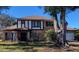 Charming two-story brick home featuring a well-manicured lawn and a classic architectural style at 9130 Dollanger Ct, Orlando, FL 32819