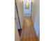 Light and airy hallway with wood-look flooring at 9130 Dollanger Ct, Orlando, FL 32819