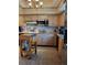 Bright kitchen featuring wood cabinets, stainless steel appliances, and ample counter space at 9130 Dollanger Ct, Orlando, FL 32819