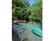 Inviting pool area with lounge chairs and tropical plants at 9130 Dollanger Ct, Orlando, FL 32819