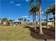 Relaxing community park with grassy areas, palm trees, and a quaint cabana at 9441 Golden Laurel Ln, Orlando, FL 32827