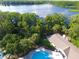 Aerial view showcasing pool, lake, and lush green landscape at 105 Northlake Dr # 105, Sanford, FL 32773