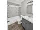Updated bathroom with gray vanity and shower/tub combo at 105 Northlake Dr # 105, Sanford, FL 32773