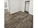 Spacious bedroom featuring wood-look floors and ample closet space at 105 Northlake Dr # 105, Sanford, FL 32773