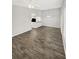 Dining room with wood-look tile floors and kitchen access at 105 Northlake Dr # 105, Sanford, FL 32773