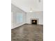 Living room with fireplace and wood-look tile floors at 105 Northlake Dr # 105, Sanford, FL 32773