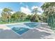 Community tennis court with green fencing and trees at 105 Northlake Dr # 105, Sanford, FL 32773