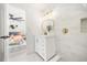 Bathroom with white vanity, marble shower, and gold fixtures, bedroom view at 1061 Lundy Ct, Winter Park, FL 32792