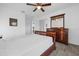 This bedroom features tile floors, a ceiling fan, natural lighting, and closet space at 1208 Old Apopka Rd, Apopka, FL 32703